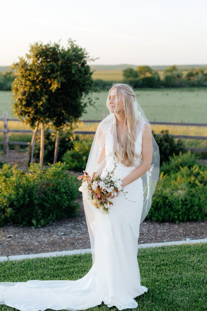 Bride with bouquet at Carter valley ranch wedding 