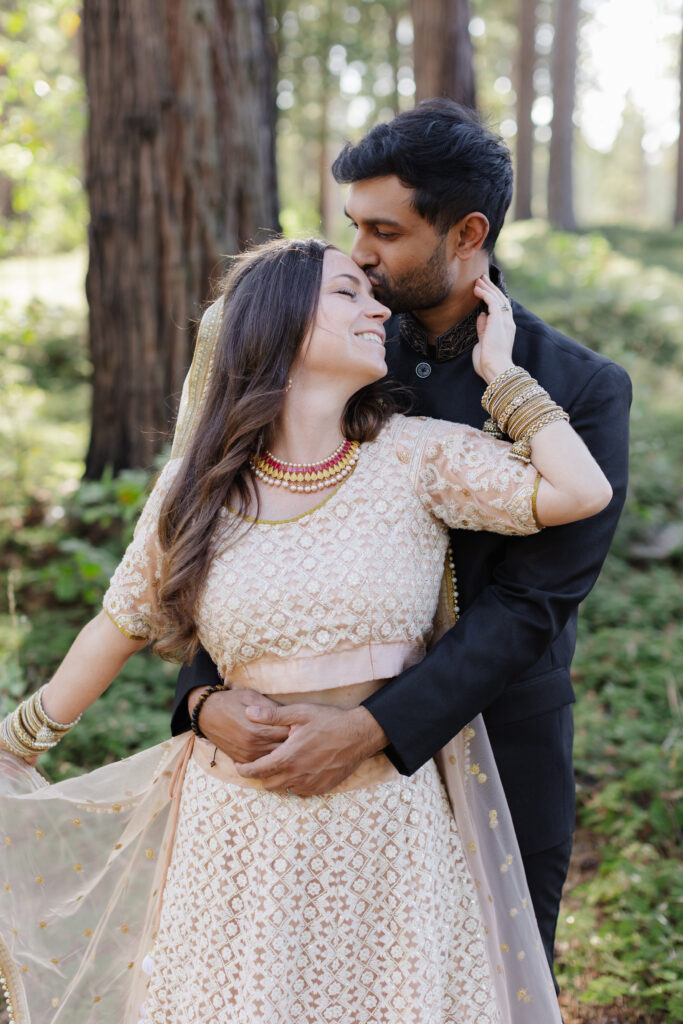 Bride and groom in Bengali wedding attire