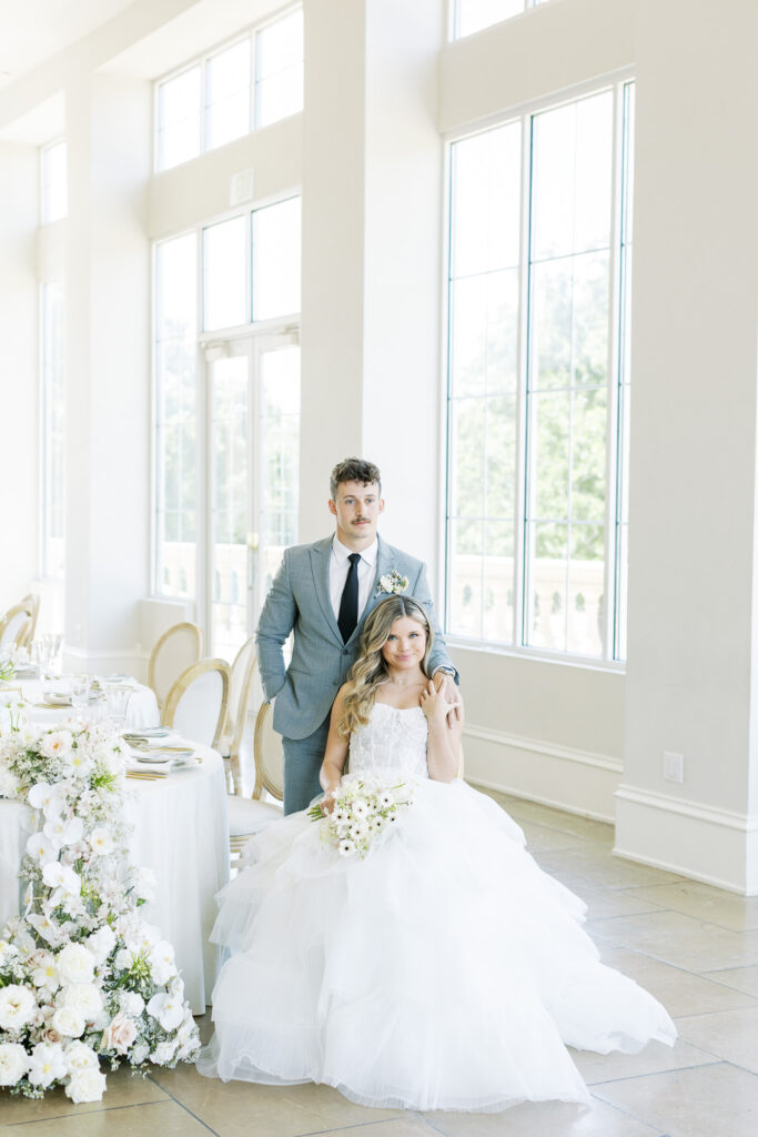 bride and groom seated in wedding reception at the Olana