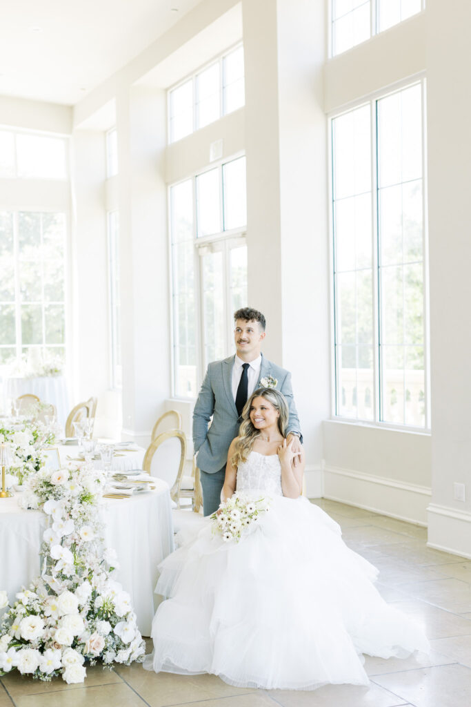 bride and groom seated in wedding reception at the Olana