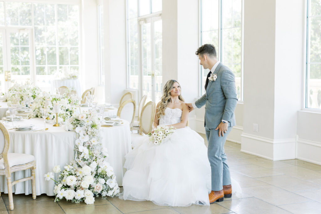 bride and groom seated in wedding reception at the Olana