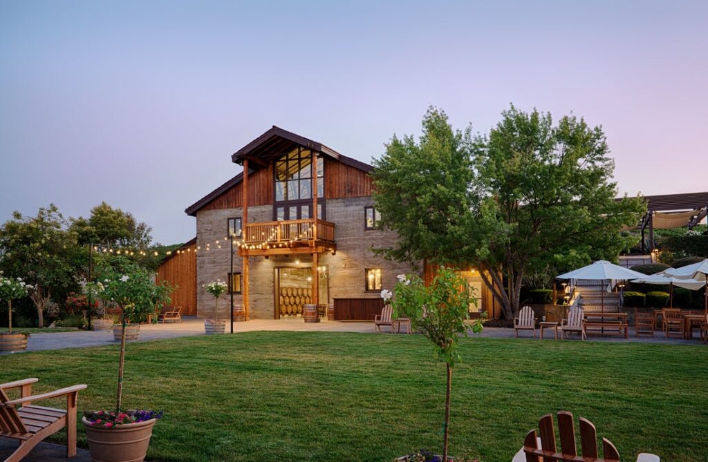 Murrieta's Well Wedding venue lawn at sunset with market lights