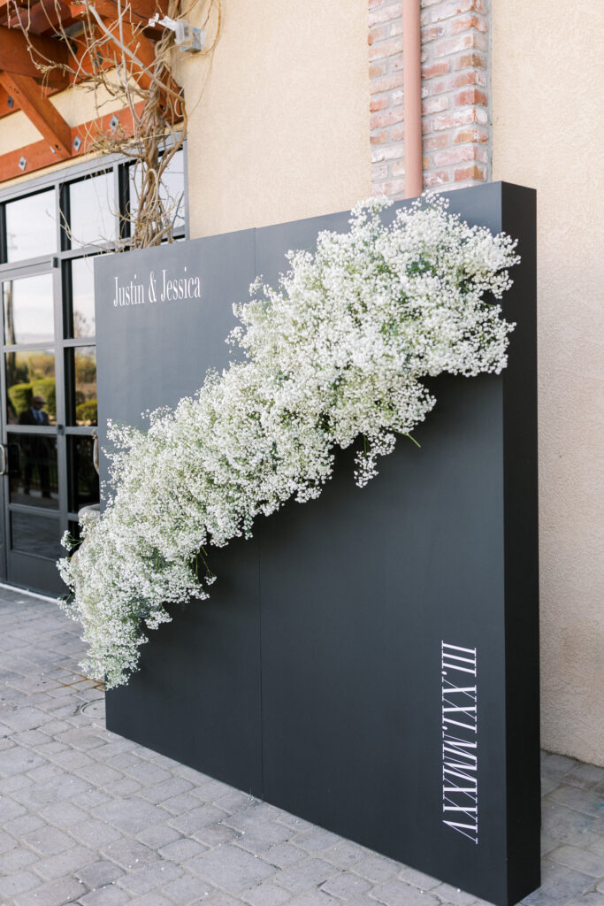 Wedding welcome wall sign with baby's breath and wedding date