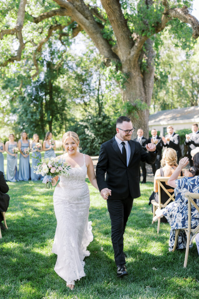 Outdoor ceremony under trees at La Réve Estate and Vineyard

