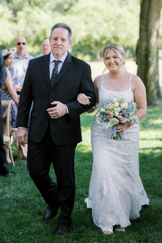 Outdoor ceremony under trees at La Réve Estate and Vineyard

