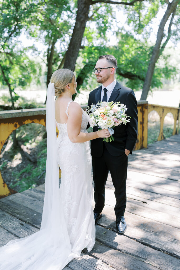 First look between bride and groom in vineyard at La Réve

