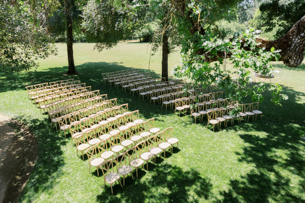Outdoor ceremony under trees at La Réve Estate and Vineyard

