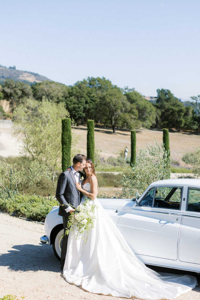 bride and groom in luxury car