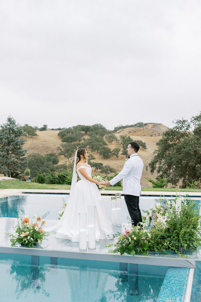Ceremony Aisle Over water with bride and groom