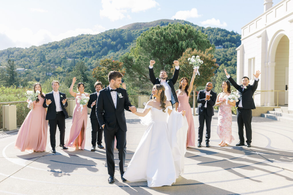Mix and match bridesmaid dresses in pink and floral tones at University Redlands Marin wedding