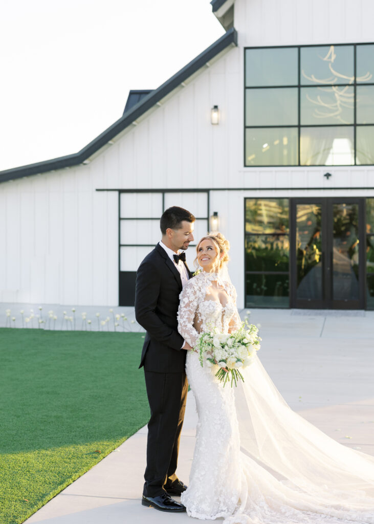 Romantic sunset portraits of the bride and groom on The Margaux’s open lawn, photographed by Fresno wedding photographer Shannon Bryn photo