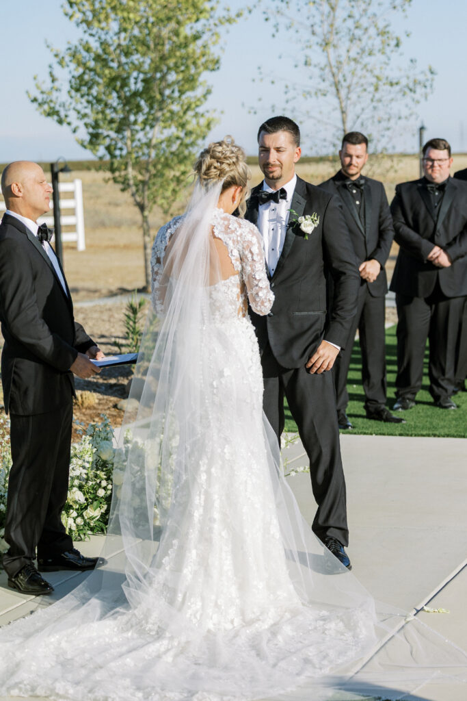 Bride and groom share a kiss during their luxury wedding at The Margaux in Madera, captured by Fresno wedding photographer Shannon Bryn Photo
