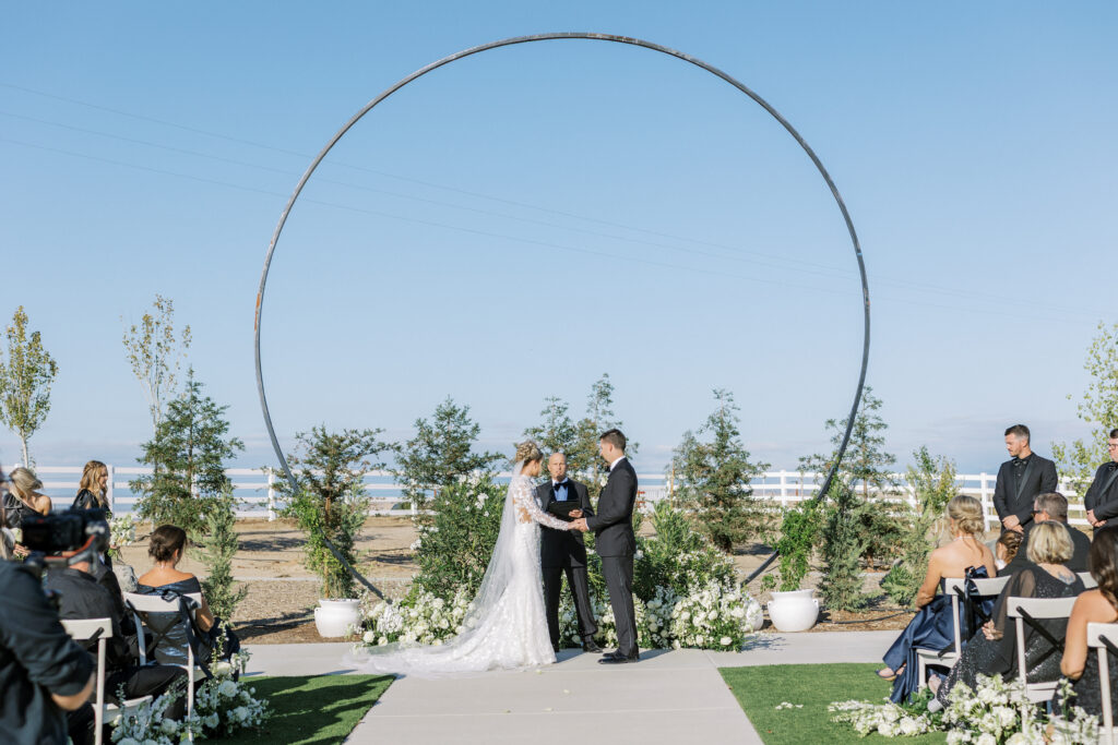 Bride and groom share a kiss during their luxury wedding at The Margaux in Madera, captured by Fresno wedding photographer Shannon Bryn Photo