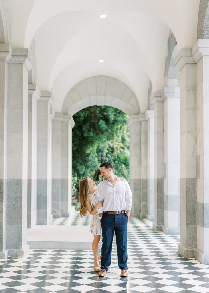 Couple embracing in front of the California State Capitol during their Sacramento engagement session