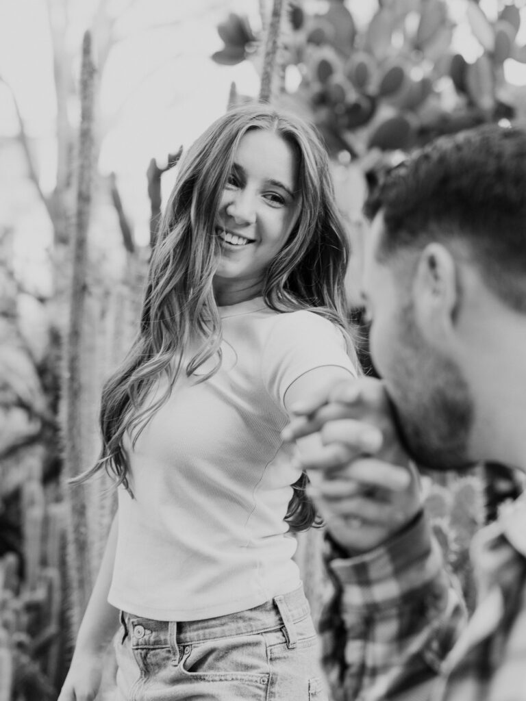 Couple laughing together among the cacti in Sacramento’s Desert Garden
