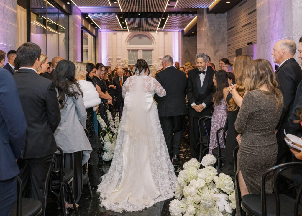 Guests seated for a Conservatory at One Sansome wedding ceremony in downtown SF