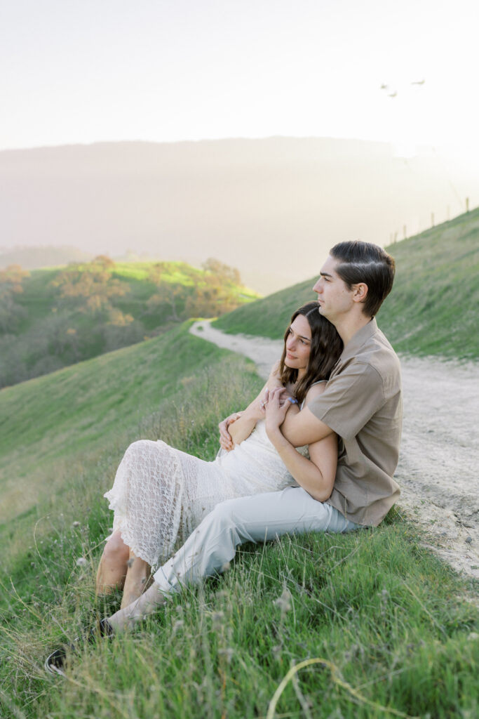 Romantic engagement portraits in the Livermore hills featuring soft light and natural movement
