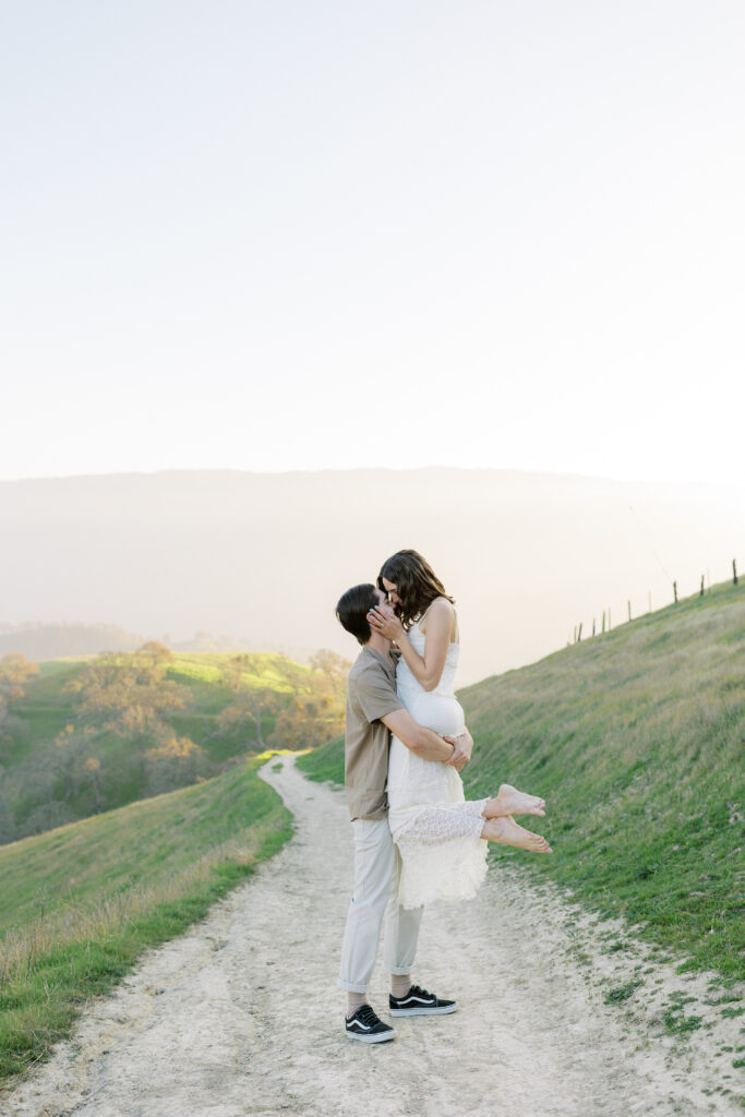 Romantic engagement portraits in the Livermore hills featuring soft light and natural movement