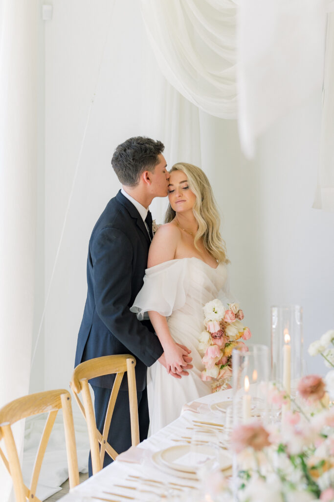 Bride and groom portraits with drapery modern wedding venue Magnolia Event Center