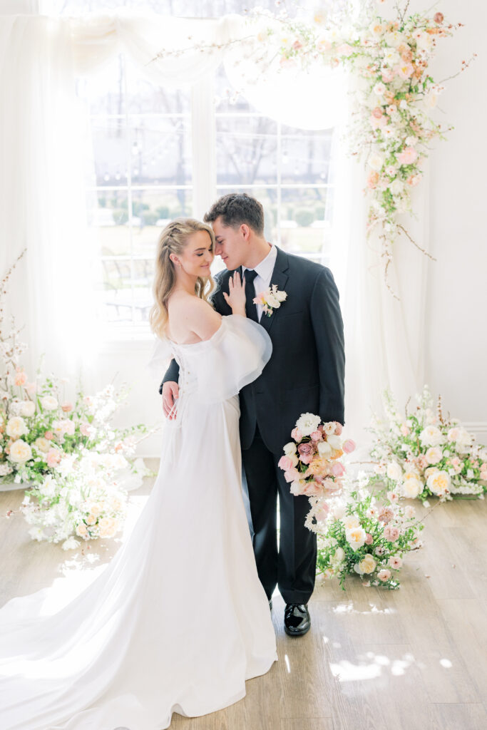 Bride and groom portraits with drapery modern wedding venue Magnolia Event Center