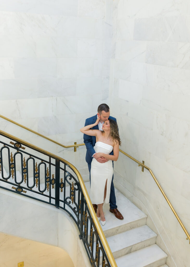 Couple walking up the grand staircase at San Francisco City Hall during engagement session |San Francisco City Hall Engagement Photos
