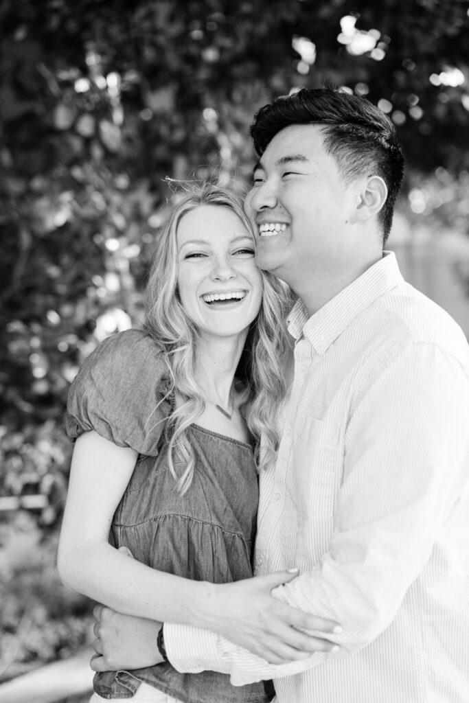 Timeless engagement photo showing couple laughing together